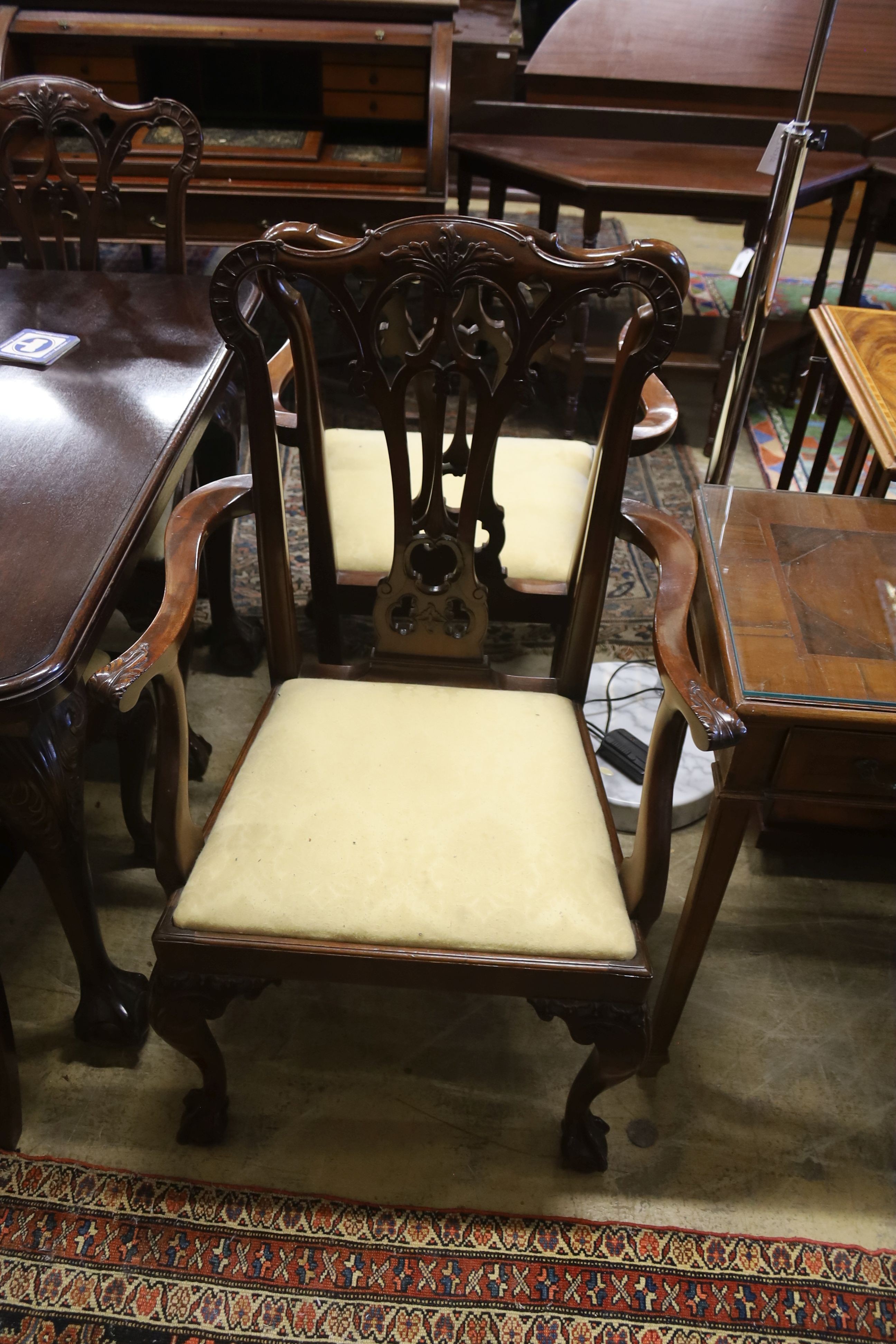 A set of eight George III style mahogany dining chairs with ball and claw feet together with a similar mahogany extending dining table, length 240cm extended (two spare leaves), width 106cm, height 74cm